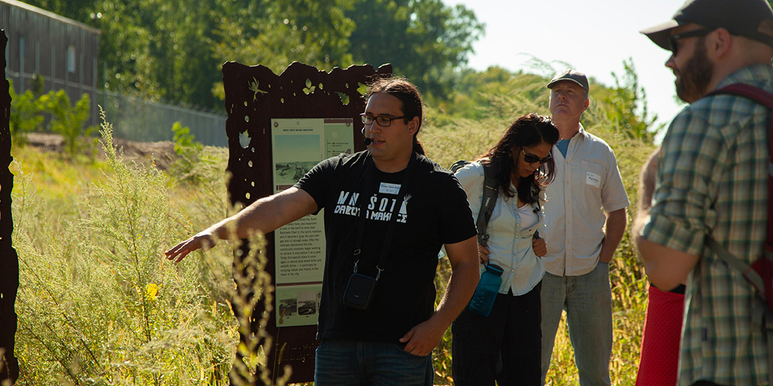 Ethan Neerdaels speaks to participants at a Learning from Place: Bdote offering.